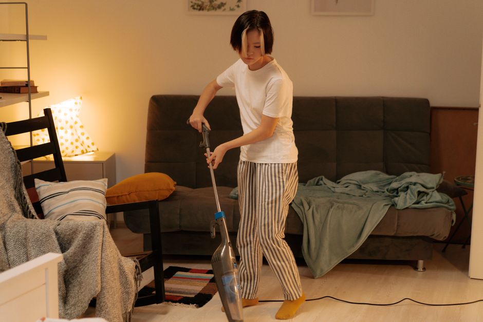 Detail of cleaning a living room sofa